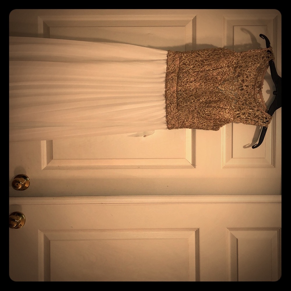 Pleated white and gold evening dress